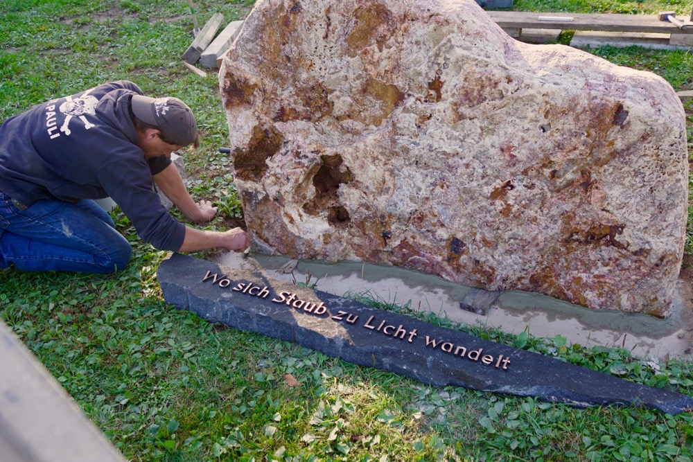 The threshold has been fixed on the concrete below the Border Stone